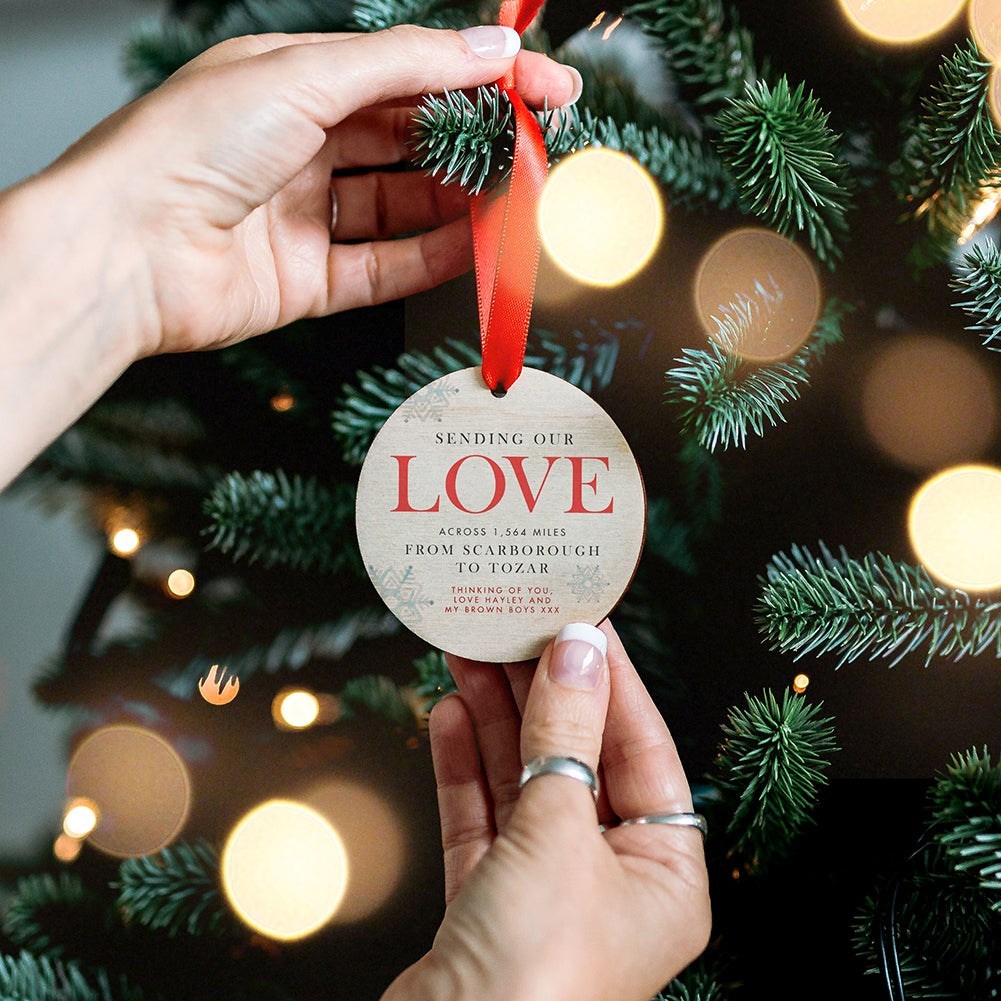 A wooden personalised Christmas tree decoration. Sending love across the miles.