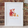 A custom family bear print in a white frame: The watercolour style illustrated family of bears show two parent bears, a child, and a baby bear. Underneath the customised words say 'The Wilson Family - Since 2012'.