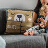 A personalised children's bedtime story cushion with a bear design. On the front are the words 'Ollie's Bedtime Story Cushion'.