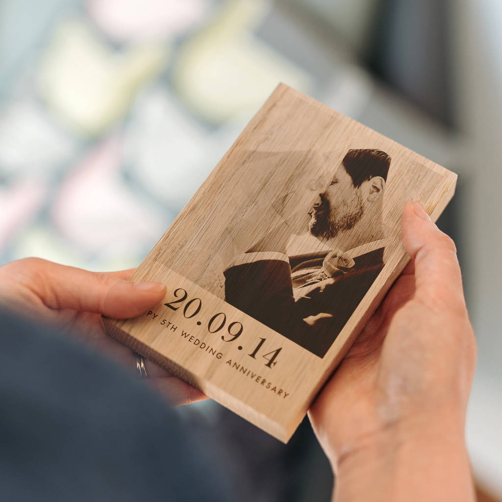 A beautifully crafted personalised wooden photo block. On the block is a photo of a newly wed couple. Under the photo are the words '20.09.2014 - Happy 5th Wedding Anniversary'.