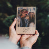 A personalised oak photo block. Printed on to the solid oak block is a photo of a couple, underneath the photo there is an outline of a heart with the couples initials (S&P) inside.