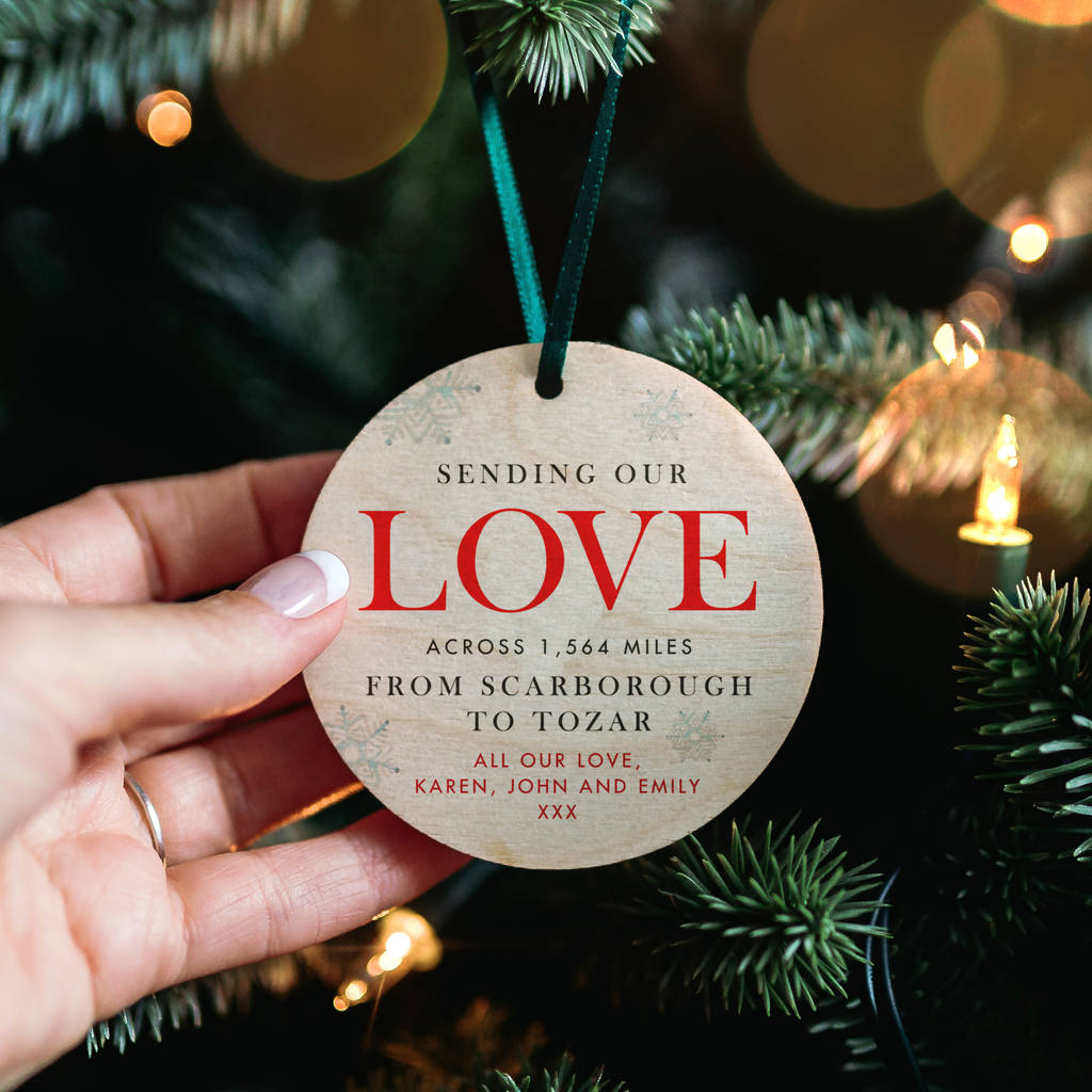 A personalised Christmas tree decoration showing the distance the love has travelled from sender to recepient.
