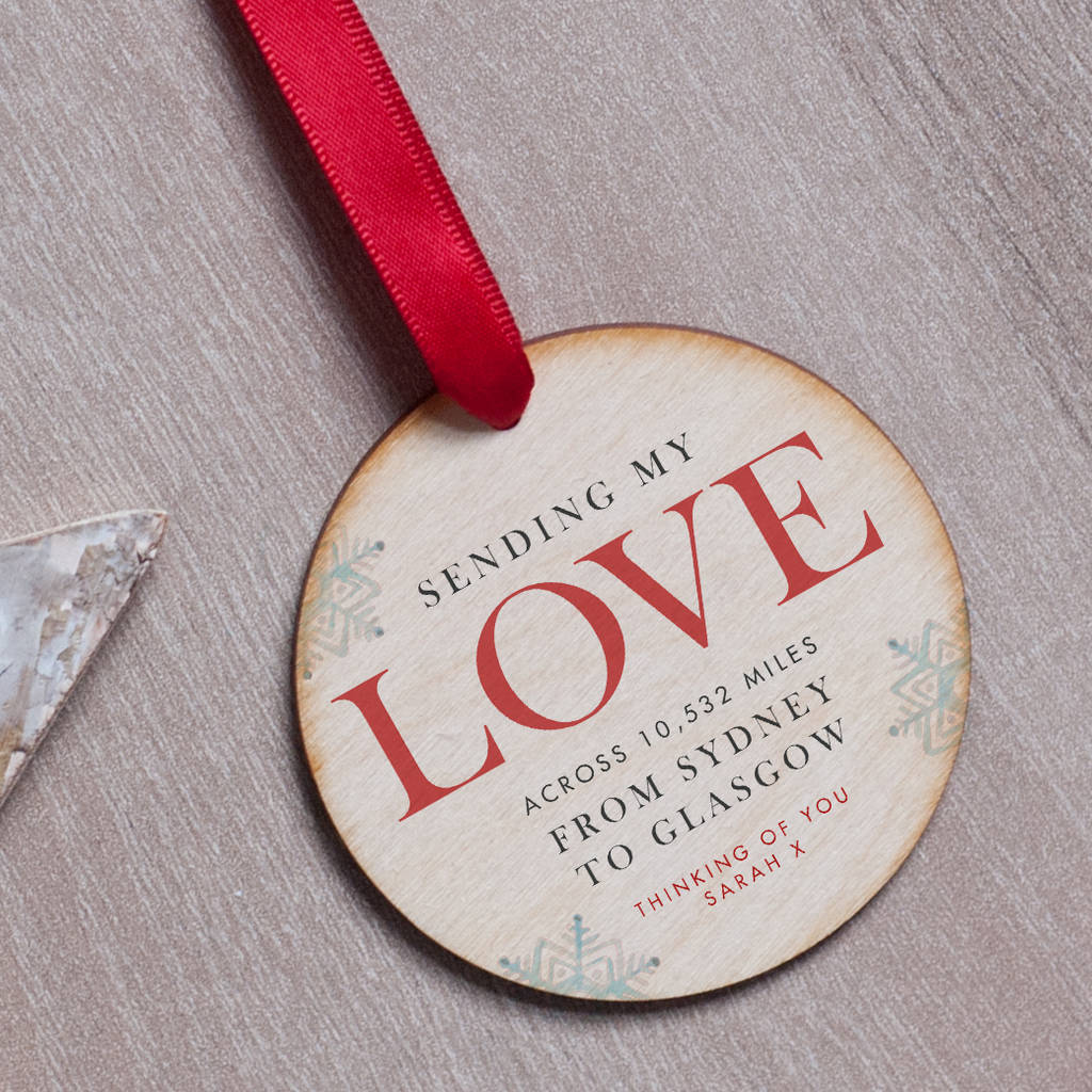 A personalised wooden Christmas tree bauble.
